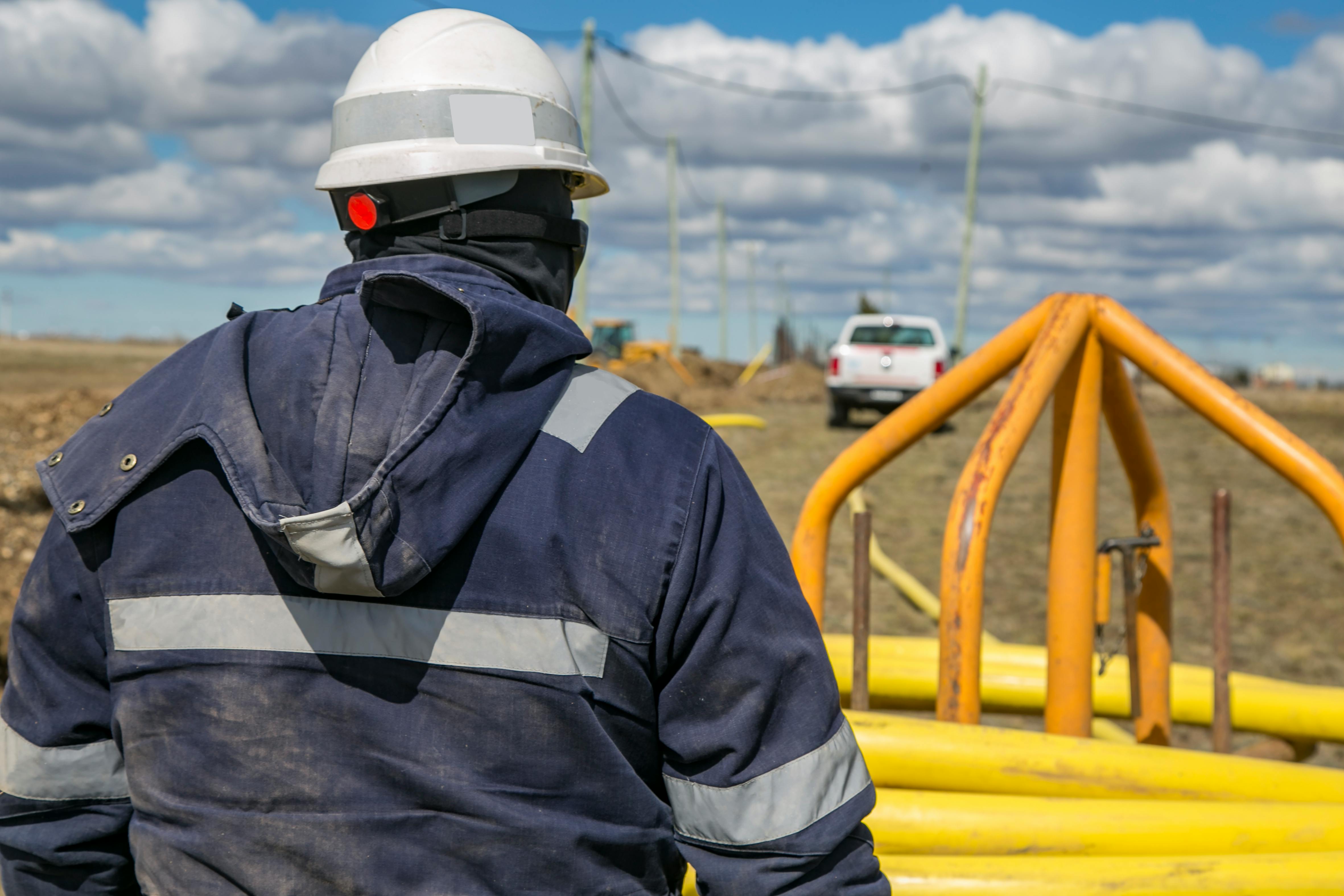 Engineer planning pipeline inspection intervals on tablet